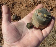 mine shown held in hand.
